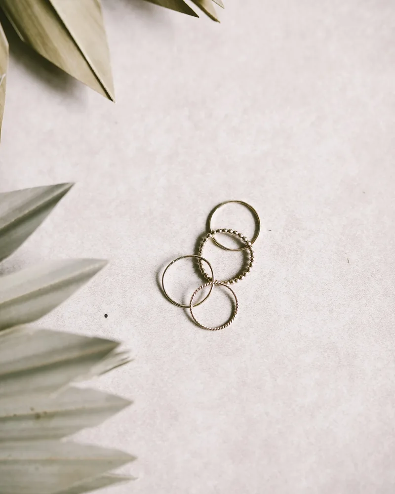 Stack of thin handmade silver rings